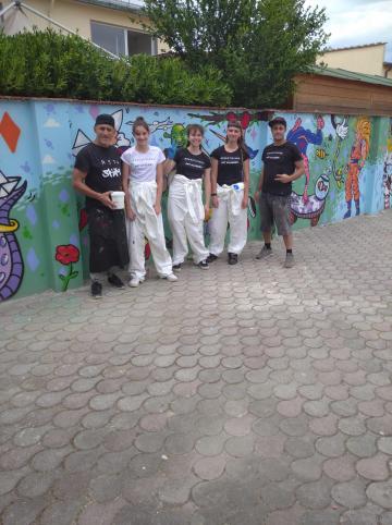 Gli artisti e l'opera di street art a Badia a Settimo
